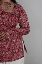Red patterned garment with a plain background