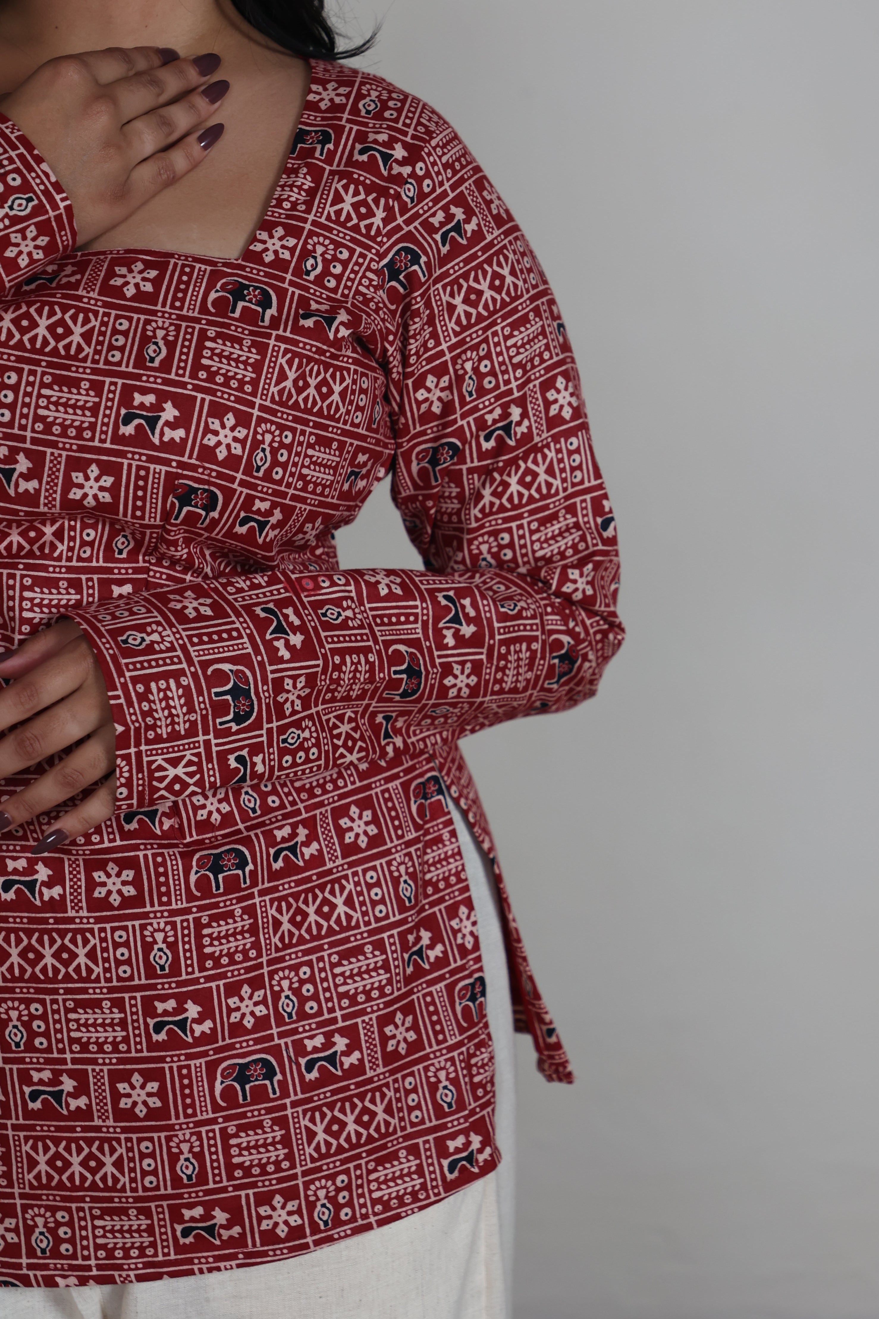 Red patterned garment with a plain background